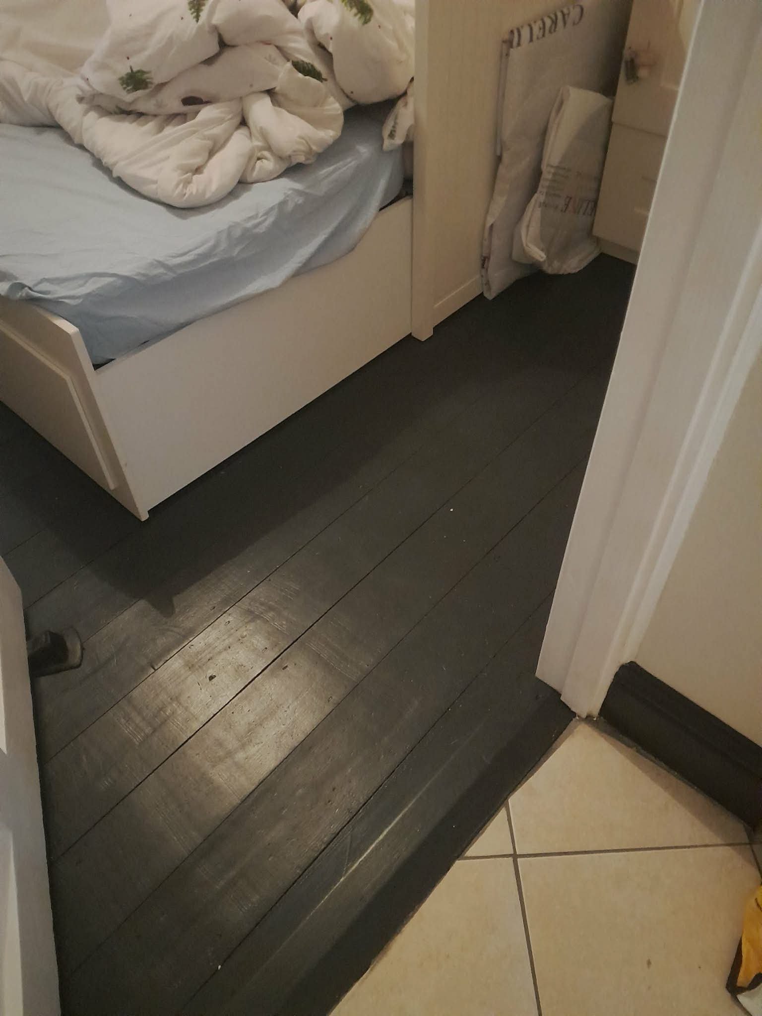 Polished floor with green skirting boards